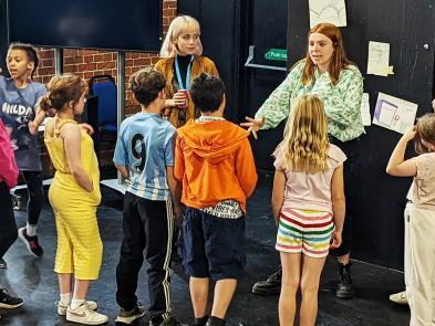 A group of children doing a workshop