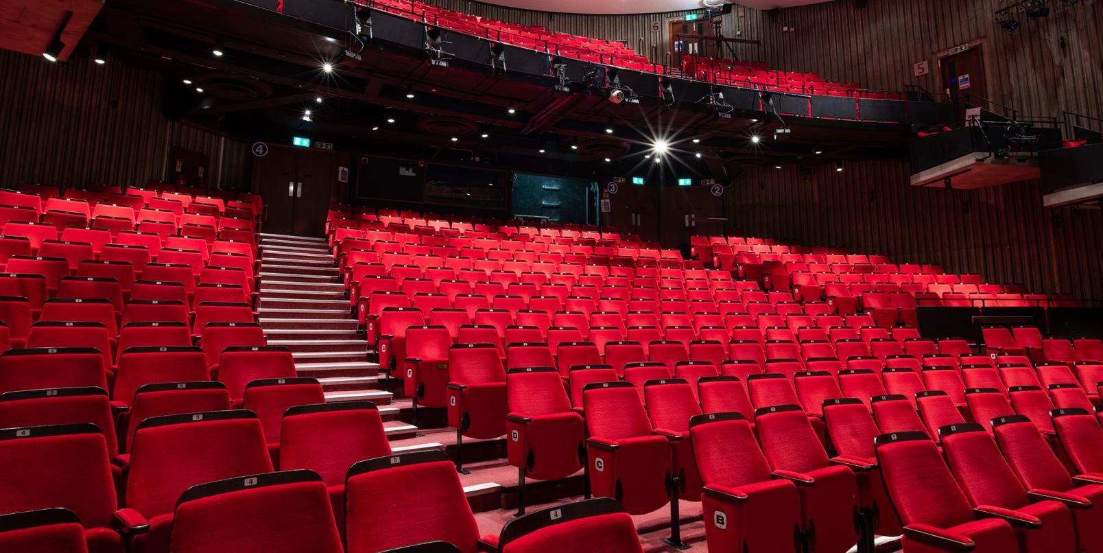 Image of red auditorium seats.