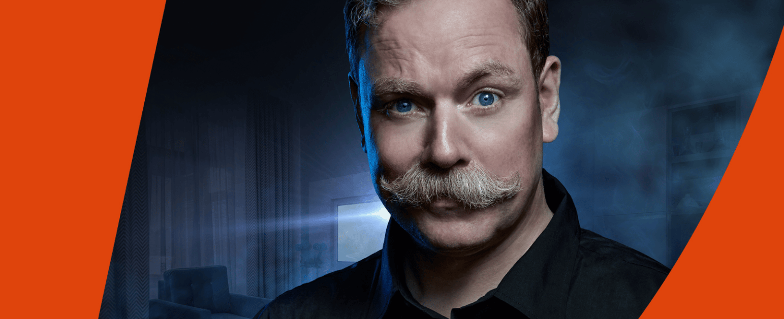Rufus Hound and an orange swish at the top and bottom of the image