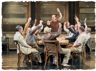 Men around a table cheering