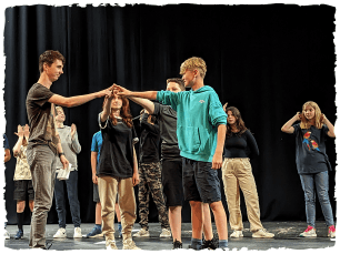 group of children stood up performing