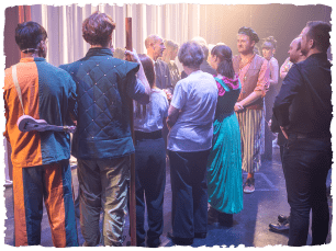 HRH backstage talking to performers.