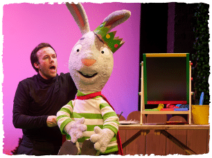 Grey rabbit puppet wearing crown