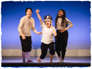 3 actors in t-shirts and trousers on stage