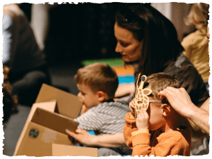 Children playing with boxes