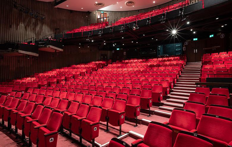 Image of red auditorium seats.