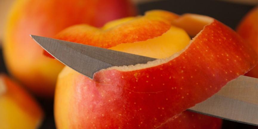 Apple peeled by a sharp knife