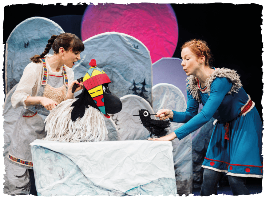 Women holding littlest Yak puppet, women holding crow puppet