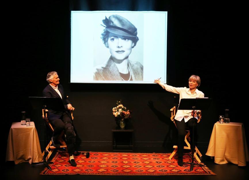 Lucy Fleming and Simon Williams stood at lecterns pointing at a presentation with a photo of Celia Johnson on it
