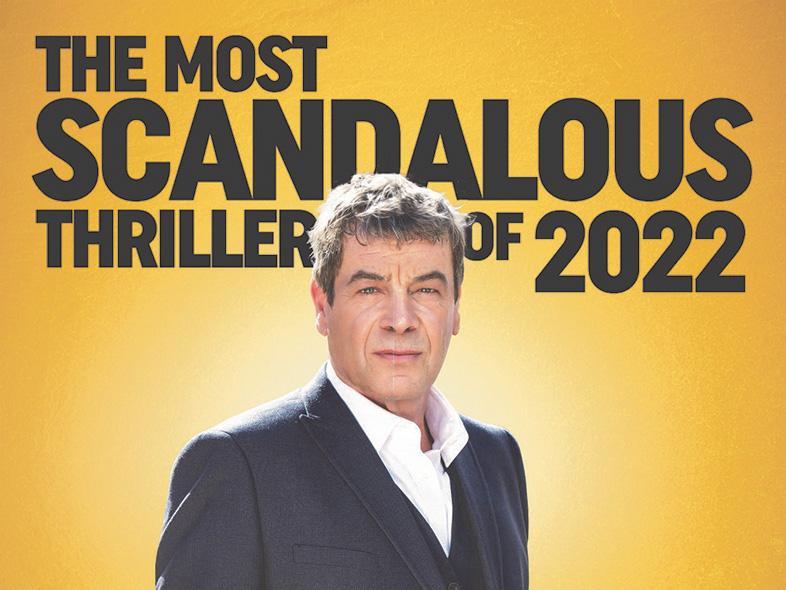 A yellow background with a man stood centre in a suit and white shirt. Black text is behind him saying 'The most scandalous thriller of 2022'.