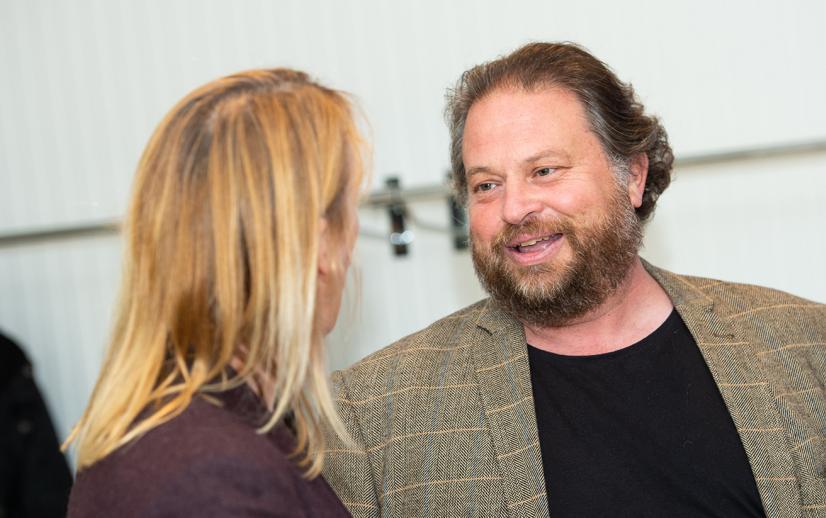 An image of a woman and man talking at an event