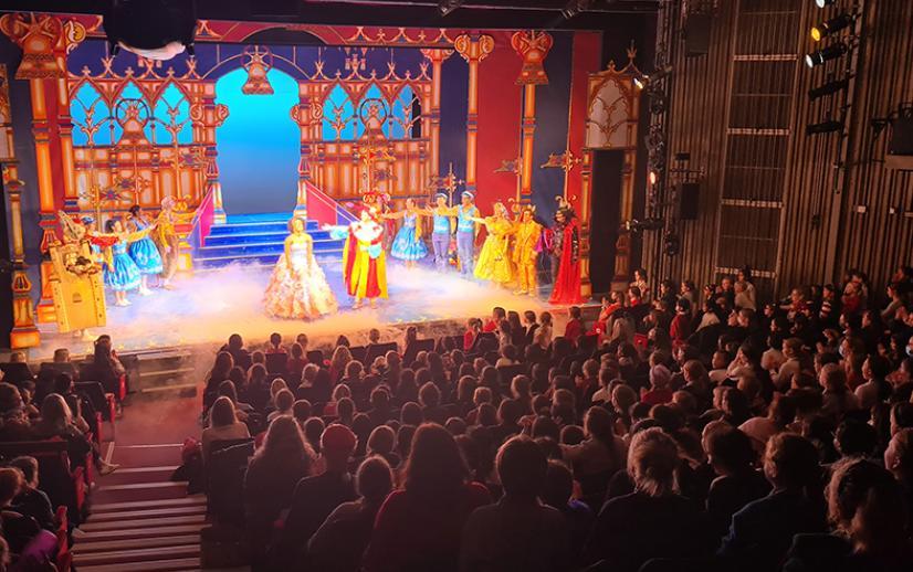 An audience filled of young carers enjoy our christmas pantomime.