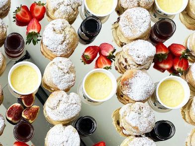 Image of scones, cream, and berries.