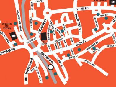 An orange abstract map of Guildford showing the location of the Yvonne Arnaud