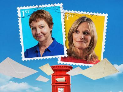 Two postage stamps, one yellow with a woman wearing a red jumper, and one blue with a woman wearing a blue top and cardigan. They float in the sky above clouds and a red post box which envelopes are flying into.