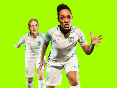 Two women in white football kits, in front of a fluorescent green background.