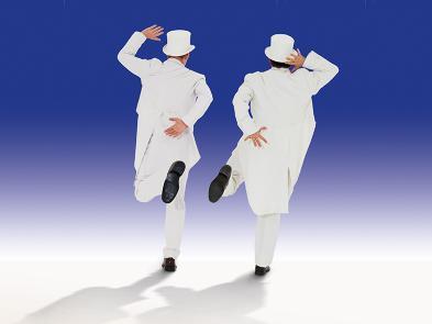 Two men in white suits and top hats skip away towards a blue horizon.