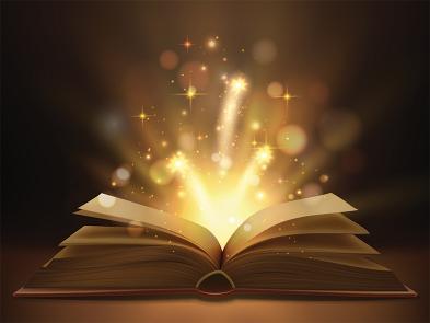 A book sits opened on a table in a dark room. Bright lights and sparked erupt from the pages.