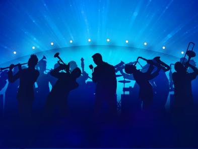 Silhouettes of a big band playing various instruments in front of a blue background.