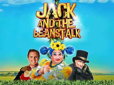 Three pantomime characters stand behind a hedge in a sunny field. A beanstalk towers behind them with the words 'Jack and the Beanstalk' entangled between it's vines.