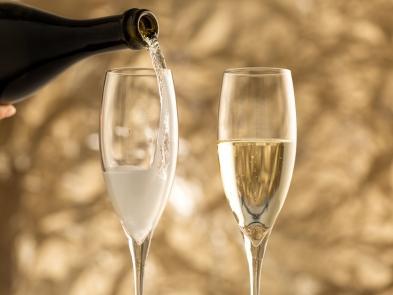 A glass of champagne being poured