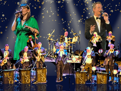 a Big Band playing brass instruments and drums in black suits with two singers above them holding microphones, one in a green dress, the other in a black suit