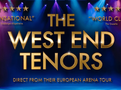 A pink  and blue lit stage with gold text saying The West End Tenors