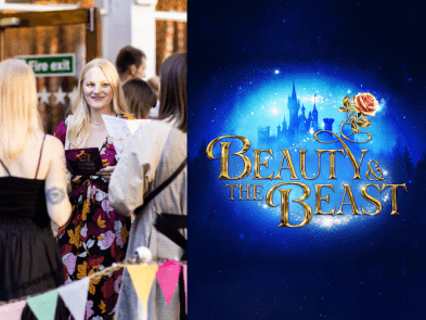 A woman with friends next to the beauty and the beast blue and gold sparkling artwork