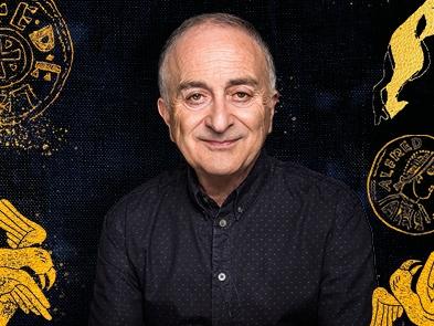 Tony Robinson in a black shirt against a dark background with yellow coloured images depicting Alfred the great and various creatures