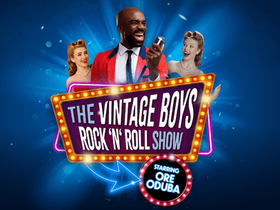 3 singers with microphones behind a light up sign that says vintage boys rock 'n' roll