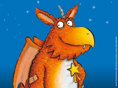 Picture of an illustrated orange dragon, smiling against a blue background.