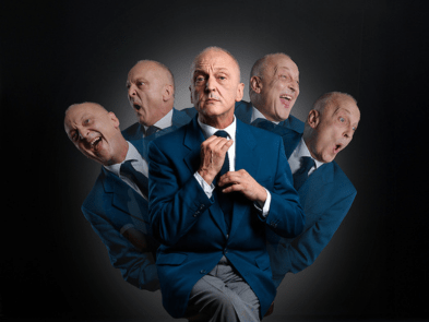 Man in blue suit, same man 5 times pulling different faces