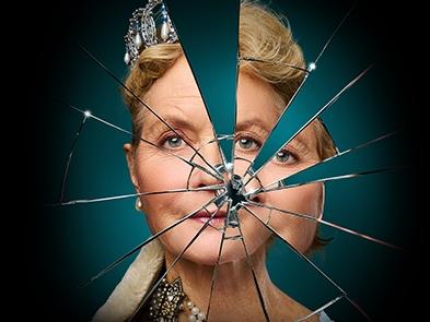 A picture of a womans face fractured into mirror pieces
