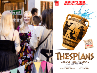 Showgoers group of people, with Thespians poster next to it