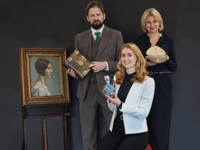 Catherine Southon  and team holding antiques