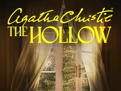 A window with cream curtains