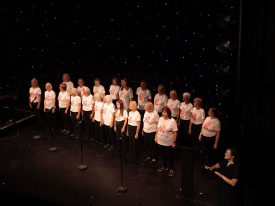 A choir performing on stage