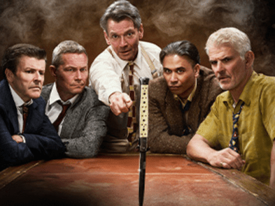 5 men round a table 