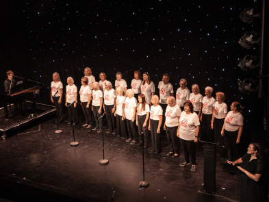 A choir performing on stage