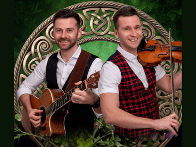 two musicians in front of a green background