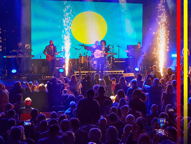 An audience watching a band