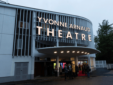 photo of the outside of the theatre with the lights on