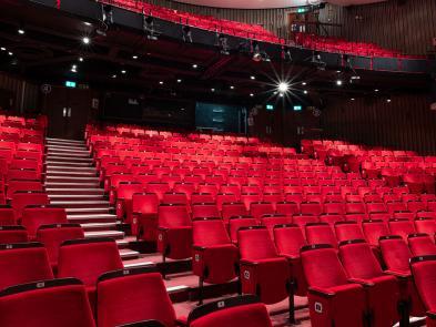 Image of red auditorium seats.